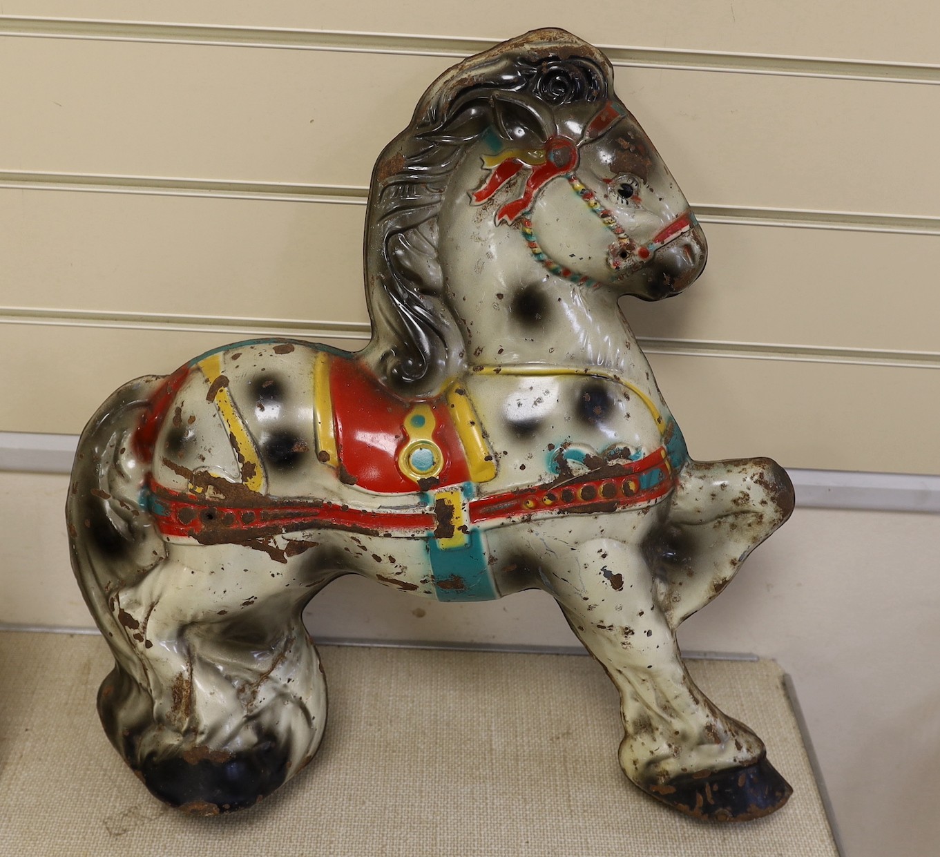 A painted toy metal model of a horse, 53cms high